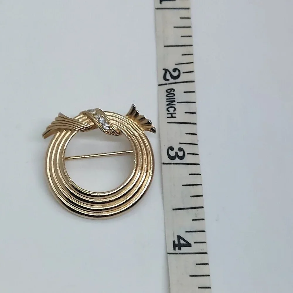 Avon Gold Tone Four Ring Circle Pin with‎ Pavé Wreath on Top￼